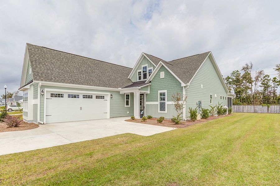 Representative exterior photo of a completed home built from the The Amherst by RobuckHomes in Windwater, Hampstead, NC (Image 27).
