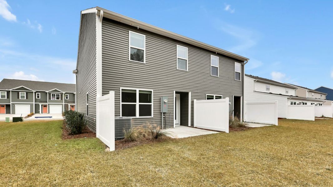 Exterior details and patio area of a home in Grayson Park Duets, Leland (Image 2).