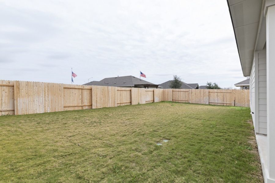 Exterior details and patio area of a home in Village at Three Oaks, Seguin (Image 4).
