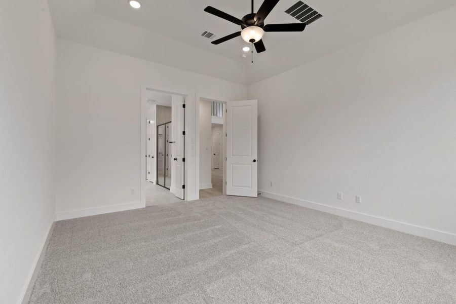 Primary Bedroom with elevated ceiling