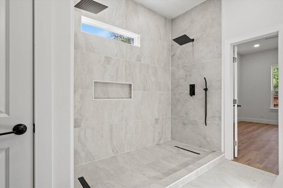 Bathroom featuring a tile shower