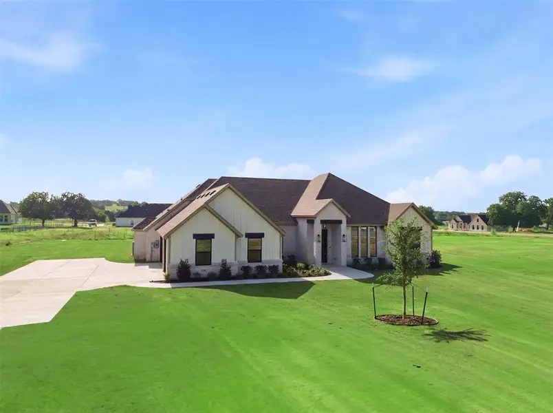 Front exterior of a new home in , Azle, TX, highlighting curb appeal (Image 2). Front exterior of a new home in , Azle, TX, highlighting curb appeal (Image 2).