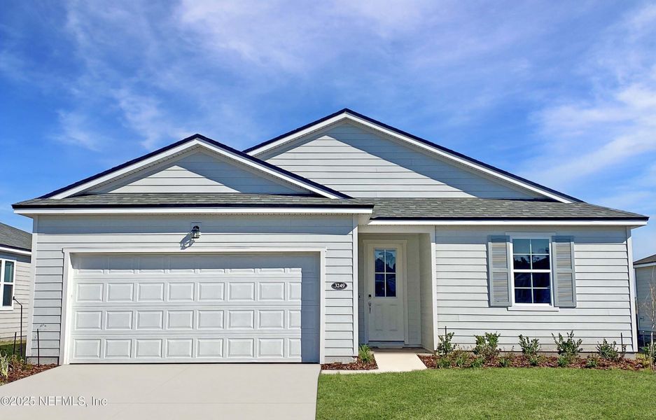 Front exterior of a new home in Lakes at Bella Lago, Green Cove Springs, FL, highlighting curb appeal (Image 1).
