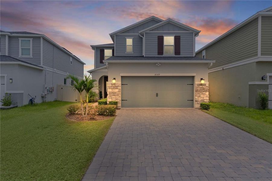 Front exterior of a new home in , Clermont, FL, highlighting curb appeal (Image 22).