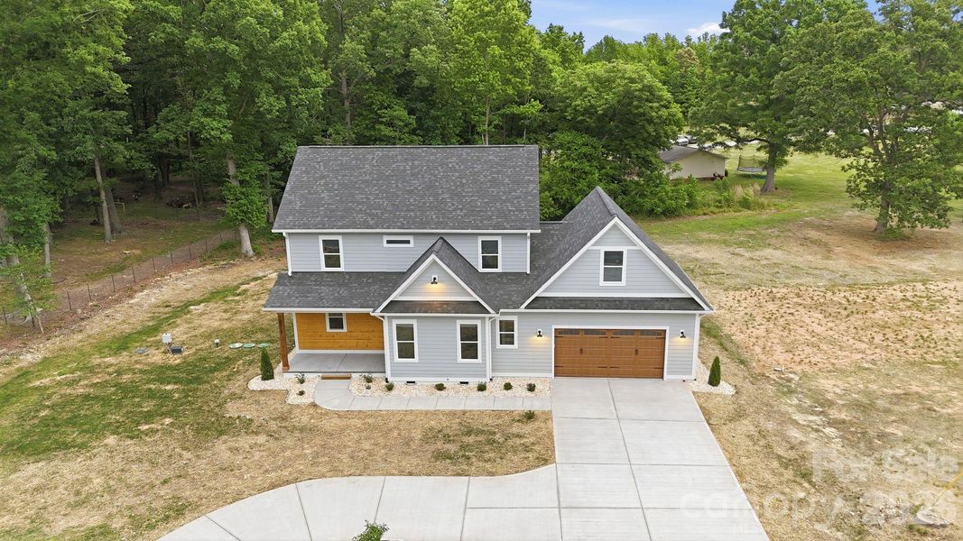 Front exterior of a new home in , Marshville, NC, highlighting curb appeal (Image 27).