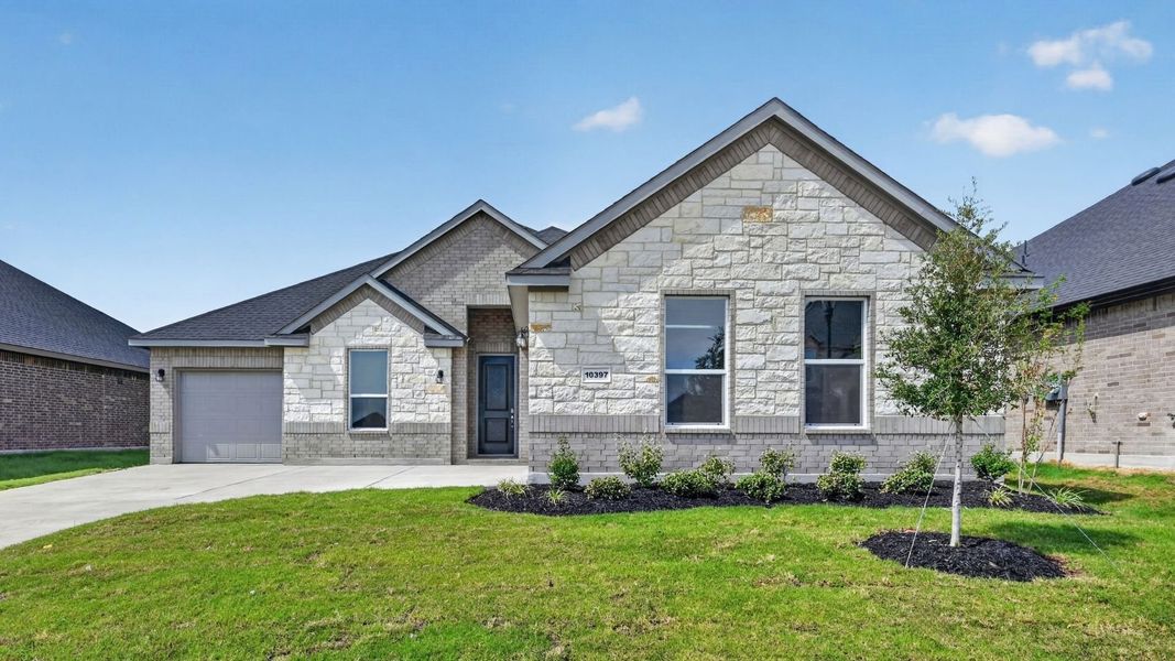Front exterior of a new home in Lakeview Pointe, Grand Prairie, TX, highlighting curb appeal (Image 2).