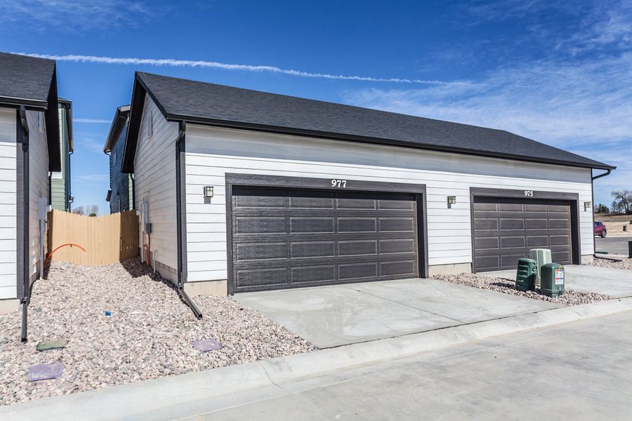 Front exterior of a new home in Prairie Song, Windsor, CO, highlighting curb appeal (Image 26). Front exterior of a new home in Prairie Song, Windsor, CO, highlighting curb appeal (Image 26).