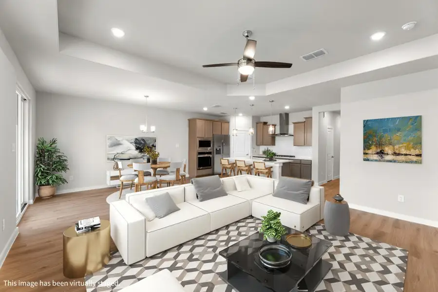 Representative furnished interior of a home built from the Valencia by Hakes Brothers in The Woodlands, Mico (Image 3).