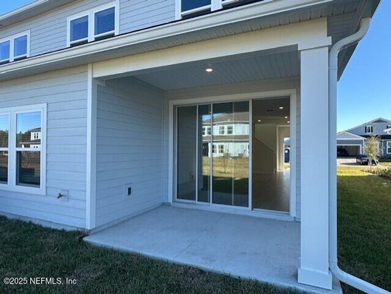 Exterior details and patio area of a home in Brook Forest - Villas, St. Augustine (Image 3).