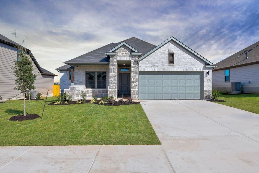 Front exterior of a new home in Prairie Winds, Hutto, TX, highlighting curb appeal (Image 2). Front exterior of a new home in Prairie Winds, Hutto, TX, highlighting curb appeal (Image 2).