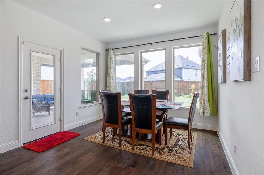 Dining space featuring recessed lighting, baseboards, and wood finished floors