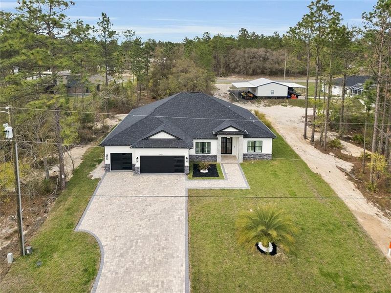 Front exterior of a new home in , Dunnellon, FL, highlighting curb appeal (Image 19). Front exterior of a new home in , Dunnellon, FL, highlighting curb appeal (Image 19).