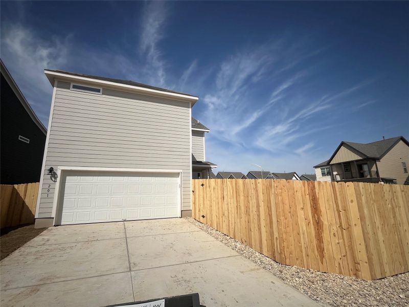 Exterior details and patio area of a home in Lariat, Liberty Hill (Image 13).