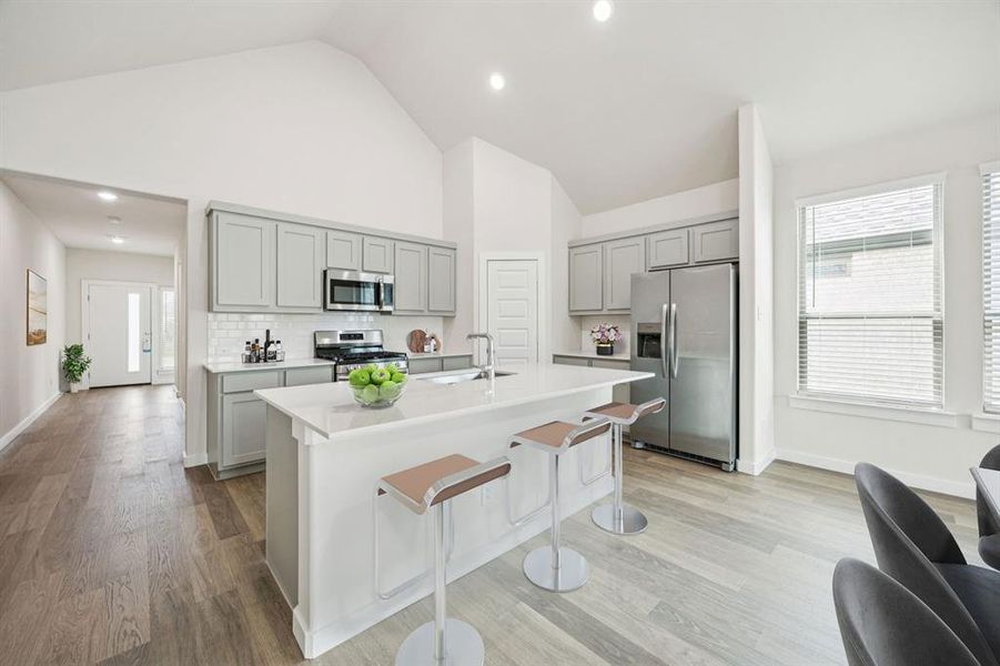 Kitchen in the Claret home plan by Trophy Signature Homes  REPRESENTATIVE PHOTO