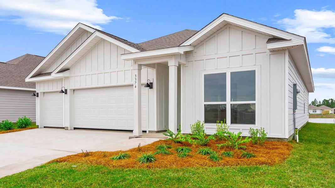 Front exterior of a new home in Hodges Bayou Plantation, Panama City, FL, highlighting curb appeal (Image 2). Front exterior of a new home in Hodges Bayou Plantation, Panama City, FL, highlighting curb appeal (Image 2).