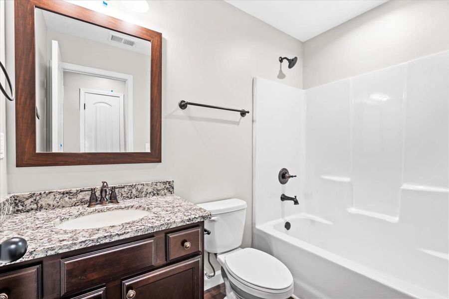 Representative furnished interior of a home built from the Wellford by Enchanted Homes in Hampshire Heights, Moore (Image 10).