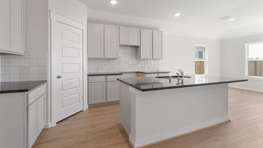 Representative furnished interior of a home built from the Blanton by Brightland Homes in Sunterra, Katy (Image 6).