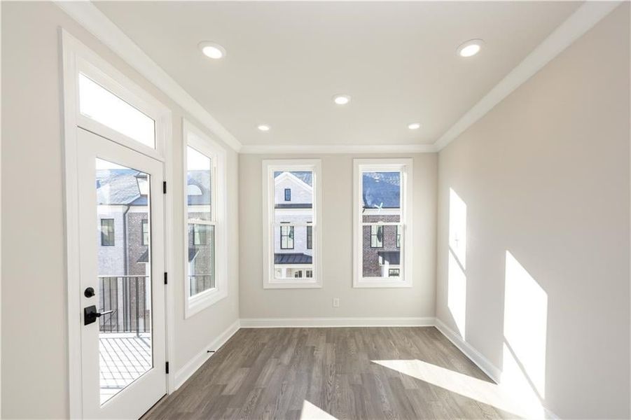 Primary bedroom sunroom space- perfect space to wind down at night or enjoy a cup of coffee to get your day started with some natural sunlight *Image is of previously built home* Primary bedroom sunroom space- perfect space to wind down at night or enjoy a cup of coffee to get your day started with some natural sunlight *Image is of previously built home*