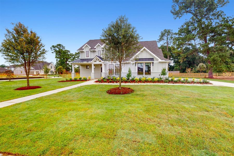 Front exterior of a new home in Sorella, Tomball, TX, highlighting curb appeal (Image 19).