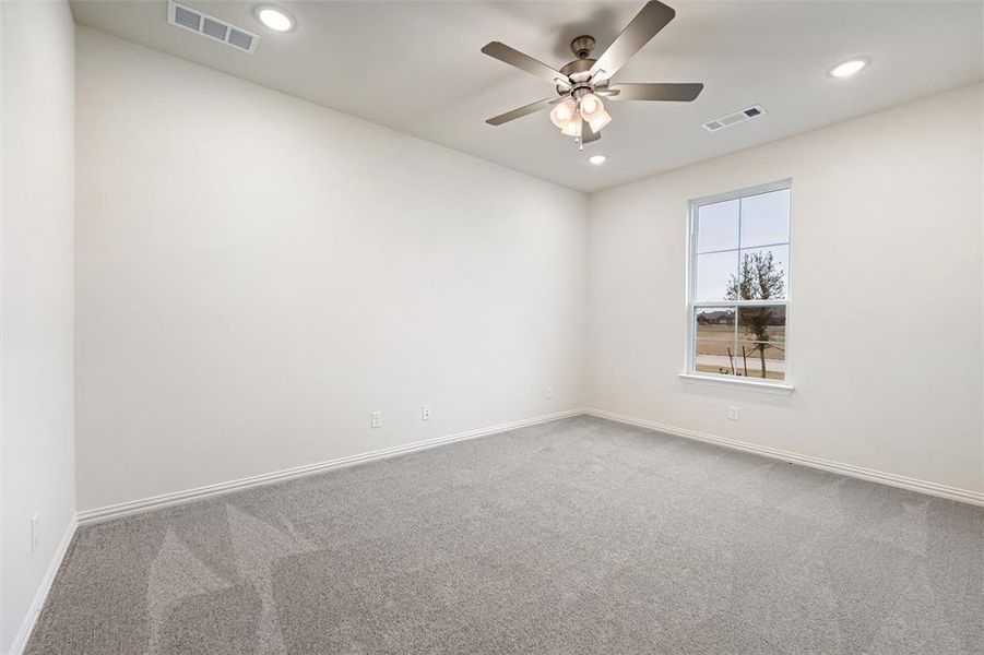 Empty room with carpet, recessed lighting, and a ceiling fan