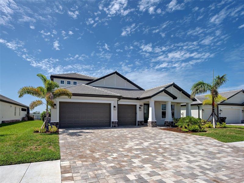 Front exterior of a new home in , Nokomis, FL, highlighting curb appeal (Image 30). Front exterior of a new home in , Nokomis, FL, highlighting curb appeal (Image 30).