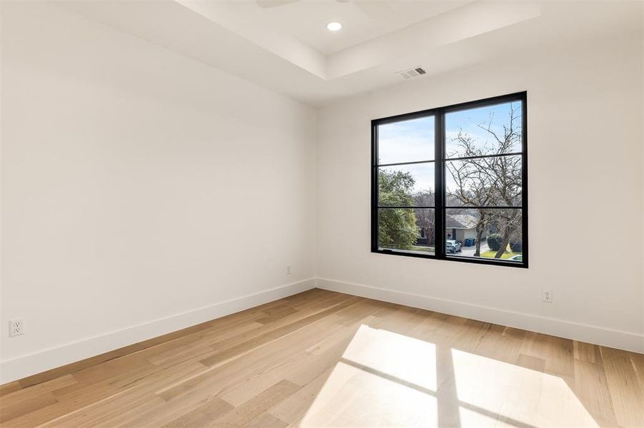 Large windows bring natural light into the guest bedrooms, keeping each space bright and inviting