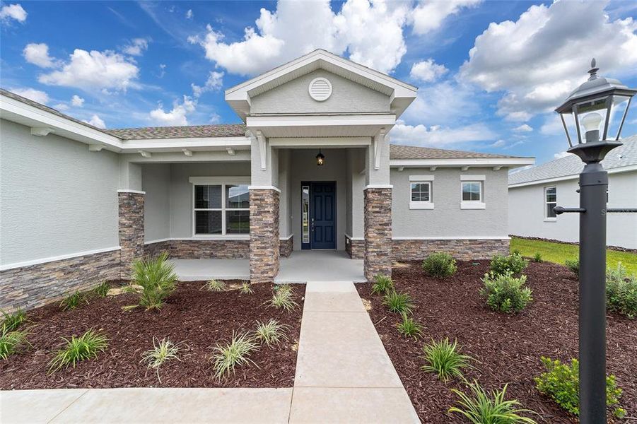 Exterior details and patio area of a home in On Top of the World Communities, Ocala (Image 23).