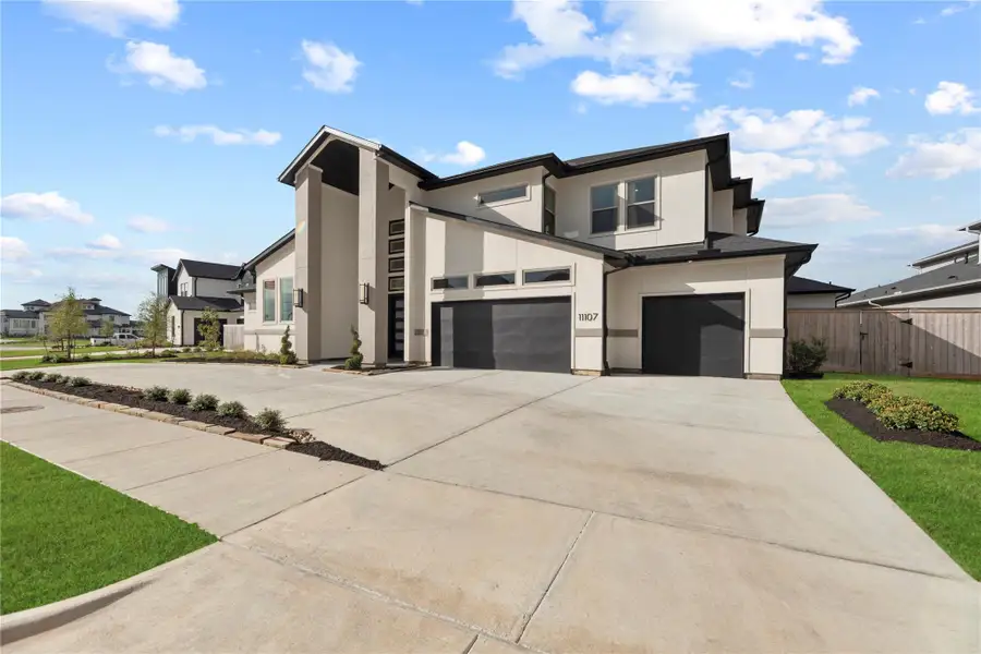 Front exterior of a new home in , Cypress, TX, highlighting curb appeal (Image 2).