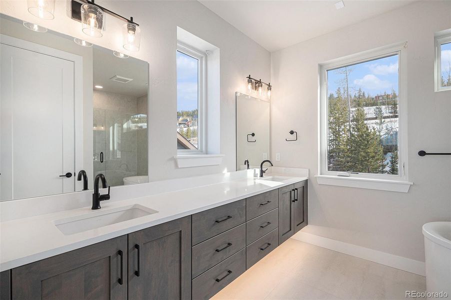 Primary 1 ensuite main level - Photos for representation only Specific colors, finishes, layout, & appliances for this home may differ.