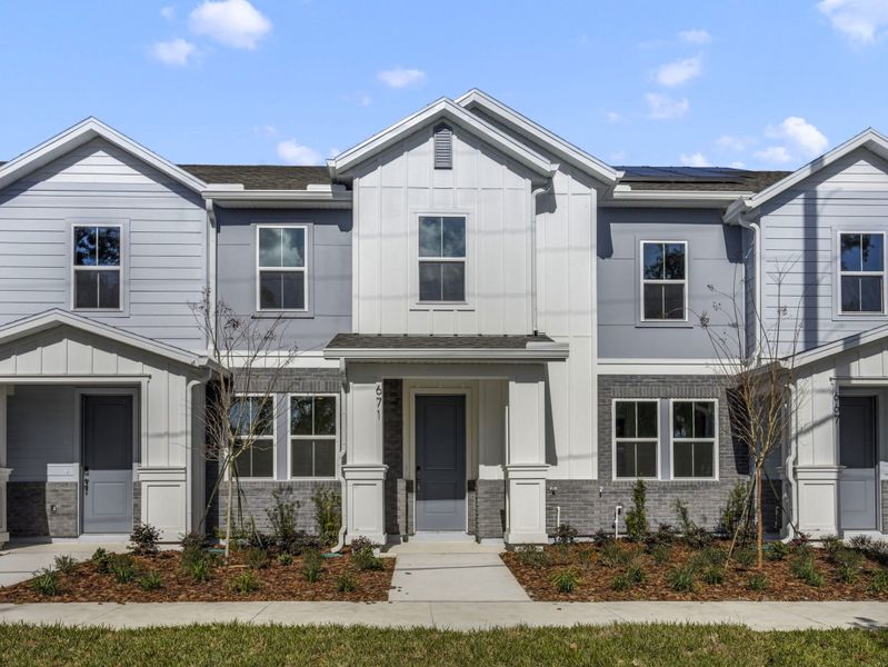 Front exterior of a new home in Aulin Square, Oviedo, FL, highlighting curb appeal (Image 1). Front exterior of a new home in Aulin Square, Oviedo, FL, highlighting curb appeal (Image 1).