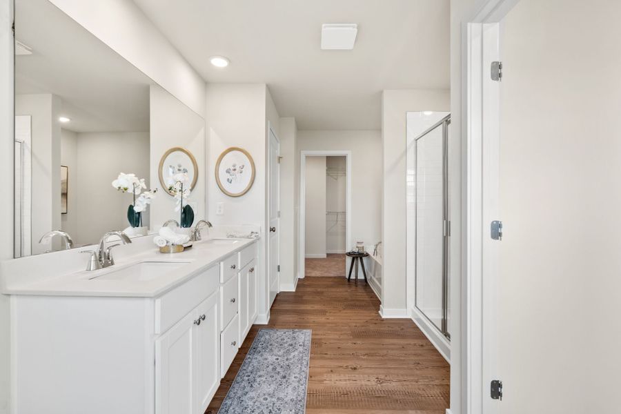 A bathroom with white cabinets. A bathroom with white cabinets.