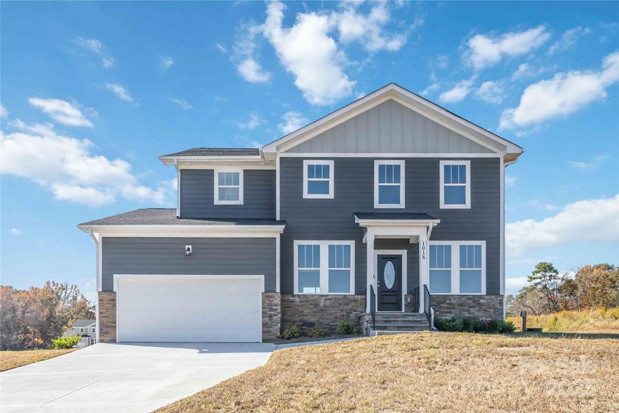 Front exterior of a new home in , Monroe, NC, highlighting curb appeal (Image 20).