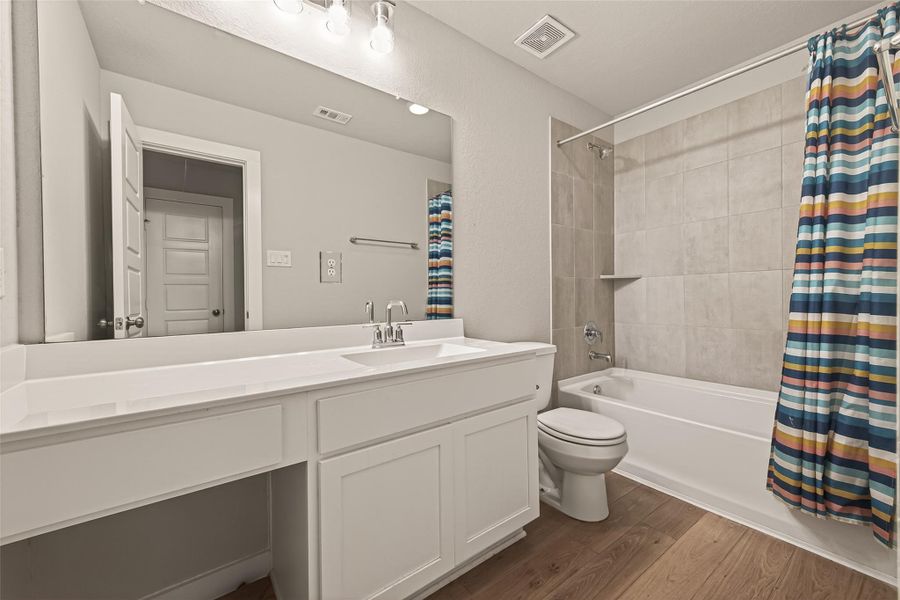 The upstairs full bath features a convenient tub/shower combination, perfect for family members and guests. The upstairs full bath features a convenient tub/shower combination, perfect for family members and guests.