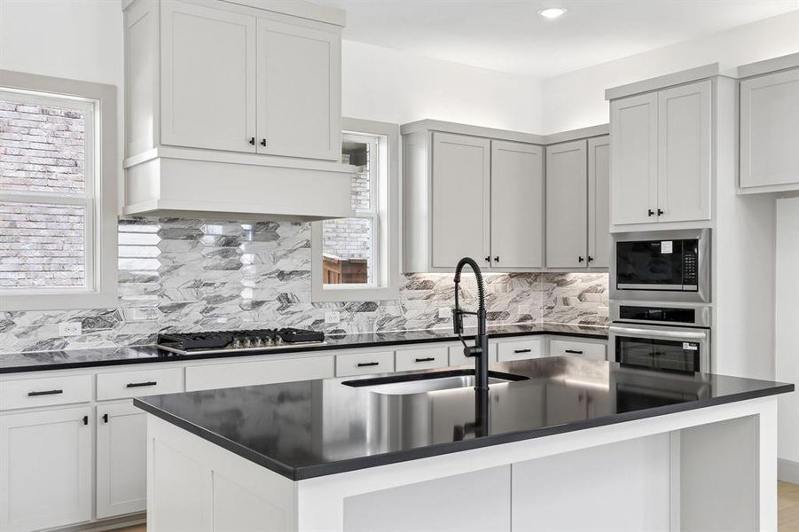 You'll enjoy ample storage and prep space along with a contemporary color palette in this chef's dream kitchen. You'll enjoy ample storage and prep space along with a contemporary color palette in this chef's dream kitchen.