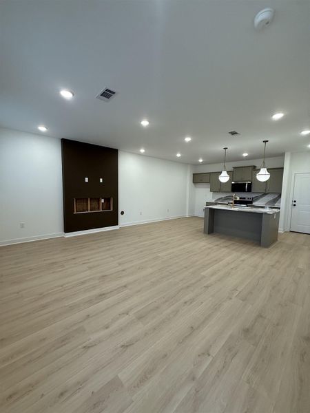 Unfurnished living room featuring recessed lighting and light wood finished floors