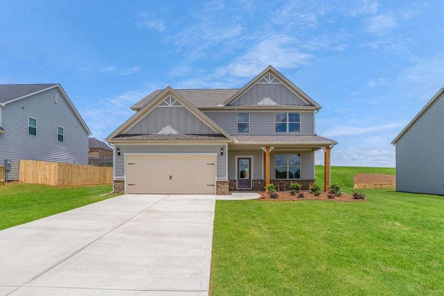 Front exterior of a new home in , Bonaire, GA, highlighting curb appeal (Image 26).
