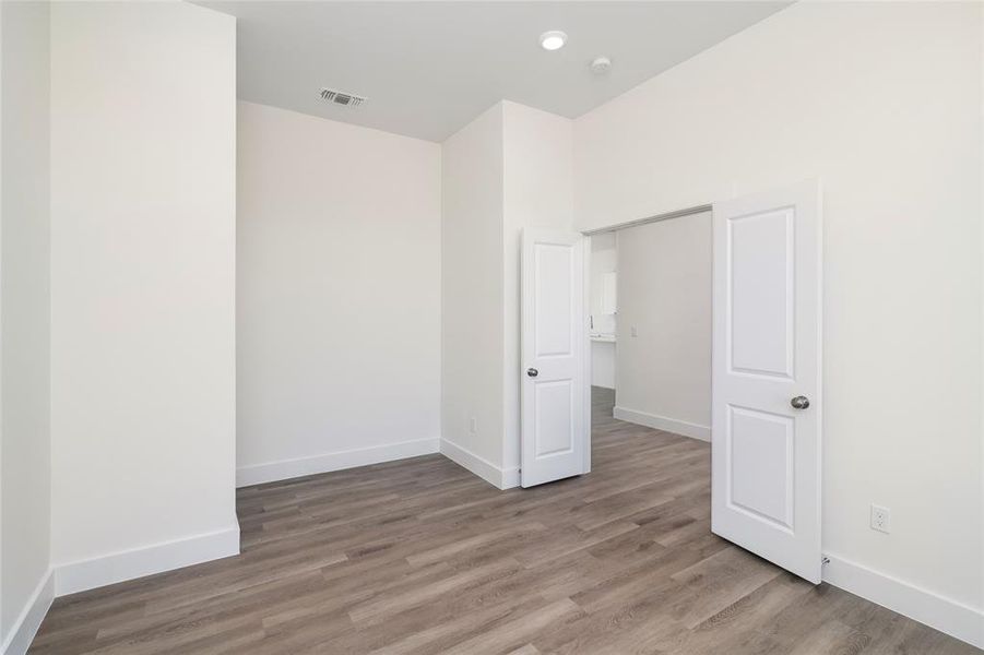 Spare room with wood-type flooring