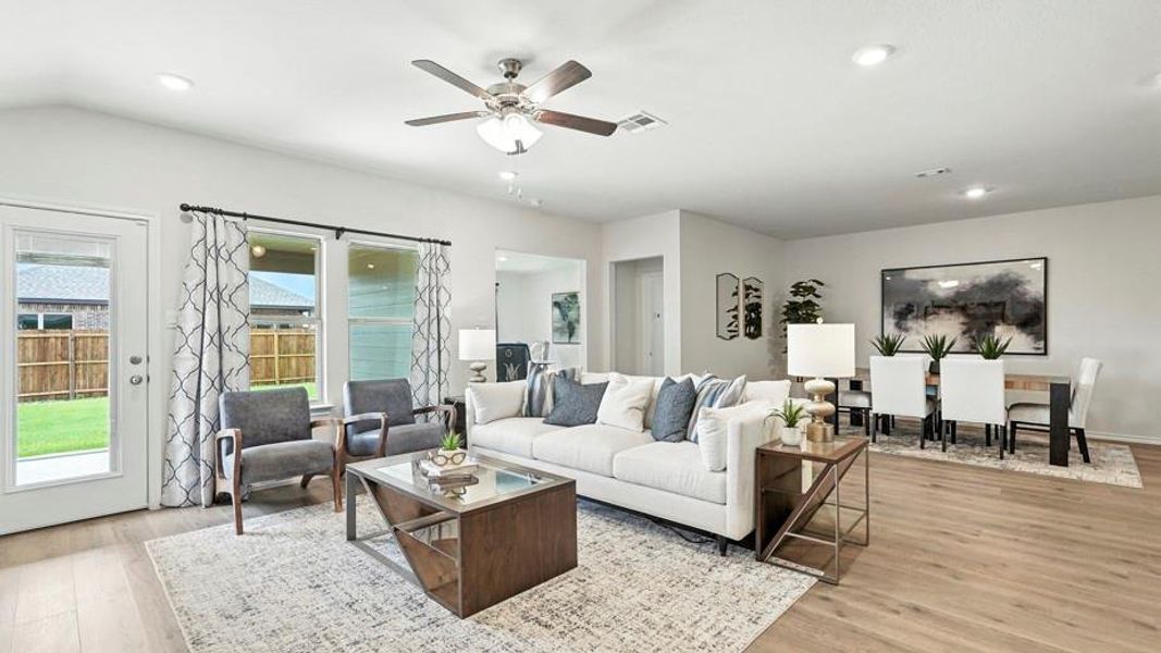 Living area featuring light wood-style flooring, a ceiling fan, and recessed lighting Living area featuring light wood-style flooring, a ceiling fan, and recessed lighting