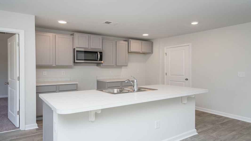 Representative furnished interior of a home built from the ARIA by D.R. Horton in Stanbury Creek, Supply (Image 5).