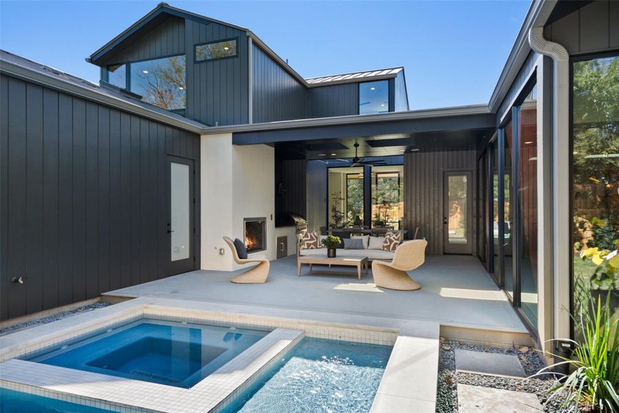 Pool, spa, and outdoor living area.