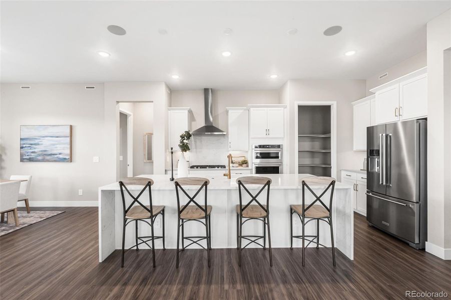 Furnished interior view inside a new home in Hilltop at Inspiration, Aurora (Image 25).