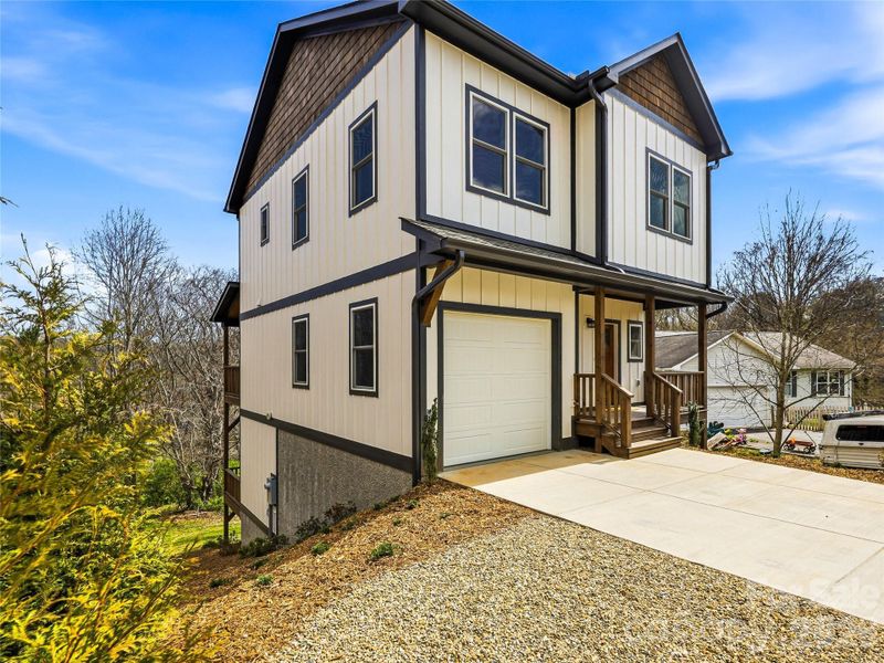 Front exterior of a new home in , Asheville, NC, highlighting curb appeal (Image 27).