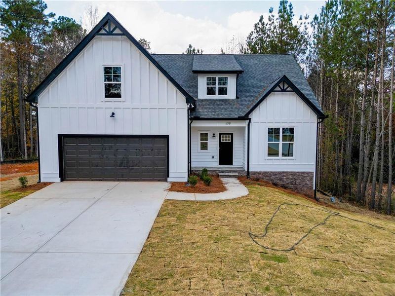 Front exterior of a new home in , Villa Rica, GA, highlighting curb appeal (Image 17).