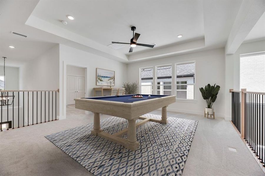 Rec room with a tray ceiling, light carpet, ceiling fan, billiards, and recessed lighting
