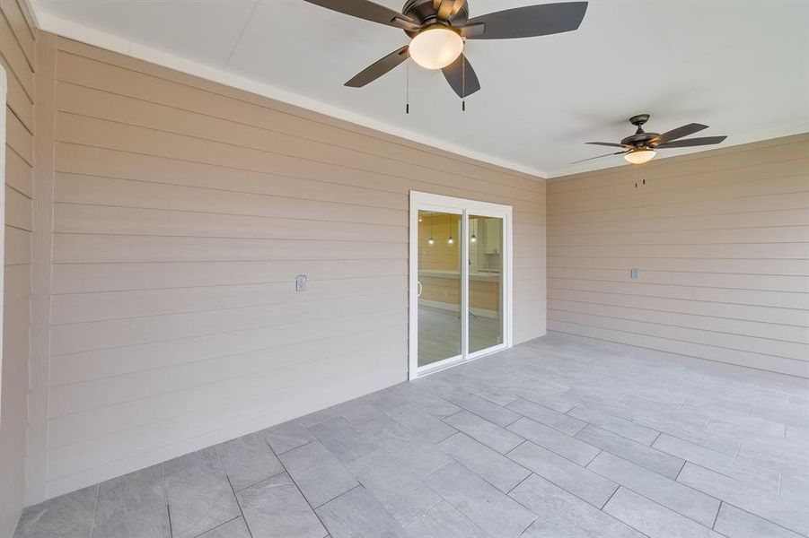 Covered patio deck providing a comfortable outdoor space for relaxing, dining, or entertaining in all weather conditions.