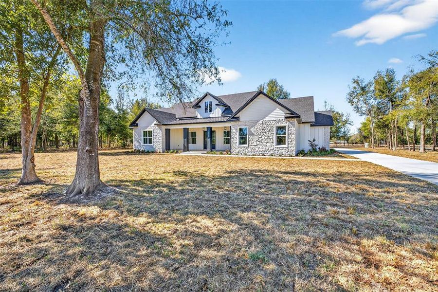 Front exterior of a new home in , Dade City, FL, highlighting curb appeal (Image 2). Front exterior of a new home in , Dade City, FL, highlighting curb appeal (Image 2).