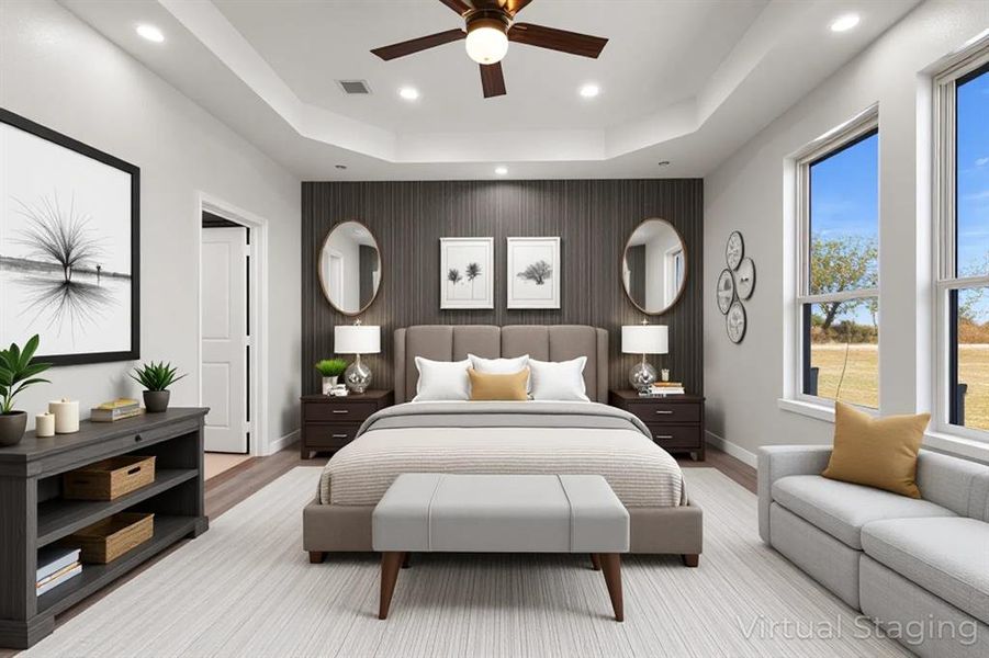 Bedroom featuring a tray ceiling, an accent wall, recessed lighting, ceiling fan, and wood finished floors