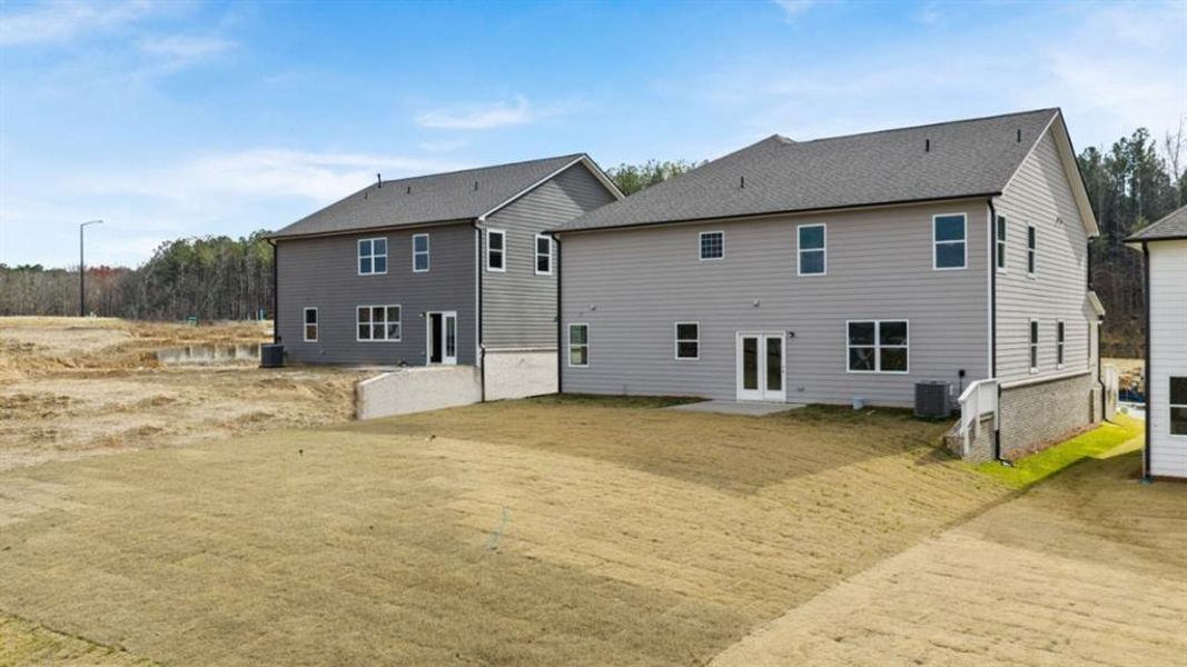 Exterior details and patio area of a home in Hamptons at Riverwood South, Dallas (Image 26).