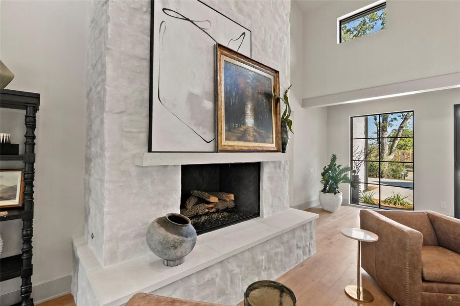 Heavily German smeared stoned fireplace reaching up to the vaulted ceiling