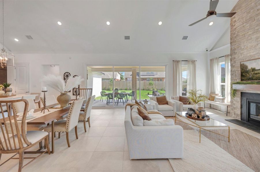 Impressive dining area and great room with 15' sliding glass doors (*Photo not of actual home and used for illustration purposes only.)